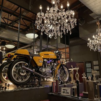 Town Hearth - Another Ducati near the entrance which ties in with the racing decor of the restaurant - American Near Me - Dallas, Texas Town Hearth - Another Ducati near the entrance which ties in with the racing decor of the restaurant - American Near Me - Dallas, Texas