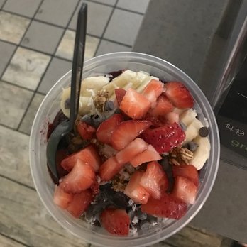 Green Tomato Grill - Brazilian Acai Bowl: basically acai blend topped with granola, banana, strawberries, vegan chocolate chips, shredded coconut, and agave - New American Near Me - Brea, California