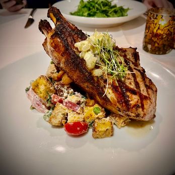 Frog Hollow Tavern - House special pork chop cooked  medium.  Perfect tonight. With buttery cornbread croutons...say, what's?!!!  Love southern fusion! - Wine Bars Near Me - Augusta, Georgia