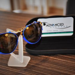 Advanced Eyecare - One of our Custom sun clips - Any shape-any size-any color... only at Advanced Eyecare.                   Your Eyes, Our Focus