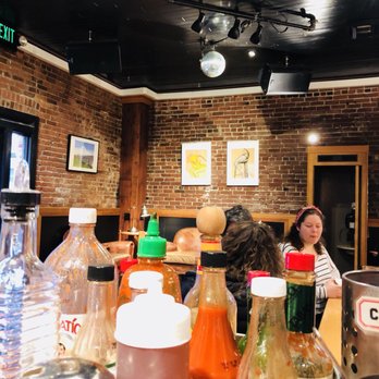 Café UNITED - a group of people sitting at a table with condiments - Coffee & Tea Near Me - Portland, Oregon Café UNITED - a group of people sitting at a table with condiments - Coffee & Tea Near Me - Portland, Oregon