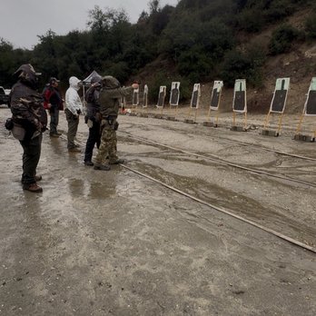 Medic Up Consulting - The instructors showing us how its done in the rain! - Firearm Training Near Me Medic Up Consulting - The instructors showing us how its done in the rain! - Firearm Training Near Me