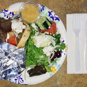 Mount Athos Restaurant and Cafe - Gyro Sandwich: Gyro meat, onions, tomatoes, & Tzatziki sauce served in a pita with a house Greek salad. - Greek Near Me - Florence, Arizona Mount Athos Restaurant and Cafe - Gyro Sandwich: Gyro meat, onions, tomatoes, & Tzatziki sauce served in a pita with a house Greek salad. - Greek Near Me - Florence, Arizona