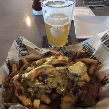 Woodson's Local Tap + Kitchen Grand Parkway - The new Woodson's location is a great place for watching games, eating great food and drink! Try the Philly Fries, you won't regret it. - American Near Me - Spring, Texas