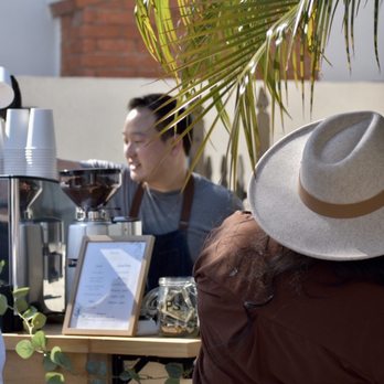 Ethnos Coffee - a group of people at a coffee shop - Caterers Near Me