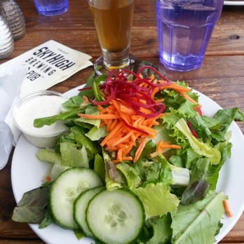 Sky High Brewery and Pub - A side salad with my beer in the background. Salad was huge and the house made dressing was yummy. - Breweries Near Me - Corvallis, Oregon