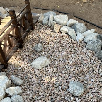 Norbert's Landscape Irrigation - Dry riverbed starts at the gutter downspout and near the front porch. Such a soothing view - Landscaping Near Me Norbert's Landscape Irrigation - Dry riverbed starts at the gutter downspout and near the front porch. Such a soothing view - Landscaping Near Me