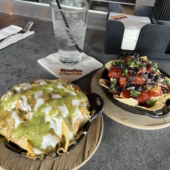 Nacho Daddy - Indiv/Happy Hour Sized Left: Enchilada Nacho Right: BBQ Chicken Nacho - Mexican Near Me - Henderson, Nevada Nacho Daddy - Indiv/Happy Hour Sized Left: Enchilada Nacho Right: BBQ Chicken Nacho - Mexican Near Me - Henderson, Nevada