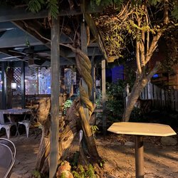 Log House 1776 Restaurant - Small outdoor seating area.
