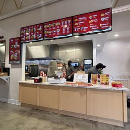 Overhead menu, order counter, and kitchen. Overhead menu, order counter, and kitchen.