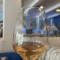 a person holding a glass of wine a person holding a glass of wine