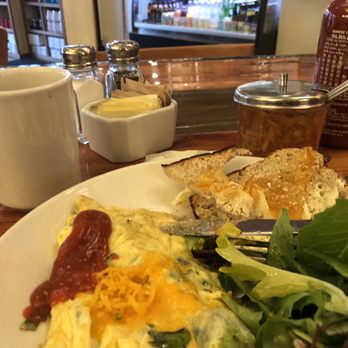Marigold Kitchen - Rosemary toast with marmalade. Field of greens salad and chorizo and southwestern corn omelette. - Breakfast & Brunch Near Me - Madison, Wisconsin