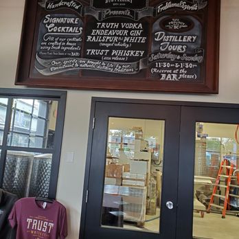 The Liberty Distillery - Information board and doors leading to distilling area. - Distilleries Near Me - Vancouver, British Columbia