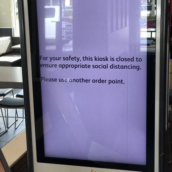 McDonald's - a sign that reads, for your safety, this kiosk is closed to ensure appropriate social distancing please - Fast Food Near Me - Jupiter, Florida