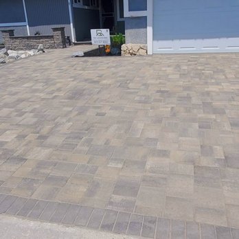 RM Landworks - Expanded new driveway with larger walkway centered to the front door. - Landscaping Near Me