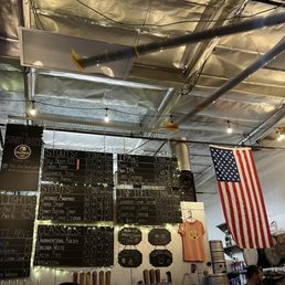 a bar with a large chalkboard a bar with a large chalkboard