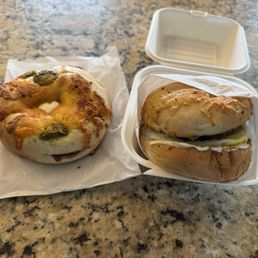Jalapeño Cheddar Bagel with Cream Cheese (left) and Sausage Bagel Sandwich (comes with cream cheese, egg, and avocado) on the right Jalapeño Cheddar Bagel with Cream Cheese (left) and Sausage Bagel Sandwich (comes with cream cheese, egg, and avocado) on the right