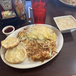 Country omelette (gravy on the side) and a biscuit. Country omelette (gravy on the side) and a biscuit.