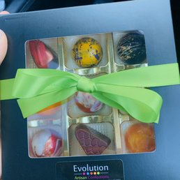 a person holding a box of chocolates a person holding a box of chocolates