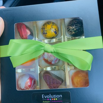 Evolution Artisan Confections - a person holding a box of chocolates - Desserts Near Me - Valparaiso, Indiana Evolution Artisan Confections - a person holding a box of chocolates - Desserts Near Me - Valparaiso, Indiana
