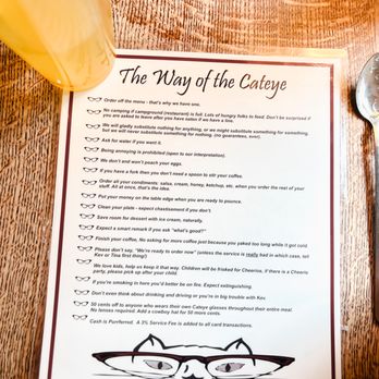 Cateye Cafe - a menu and a glass of orange juice - New American Near Me - Bozeman, Montana