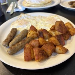 Two eggs over, home fries and sausage (missed the pic of the raisin toast! )