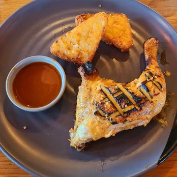 Nando's - Peri peri chicken thigh 1/4 with side of hash browns & extra hot sauce - Chicken Shop Near Me - Gatwick, WSX Nando's - Peri peri chicken thigh 1/4 with side of hash browns & extra hot sauce - Chicken Shop Near Me - Gatwick, WSX