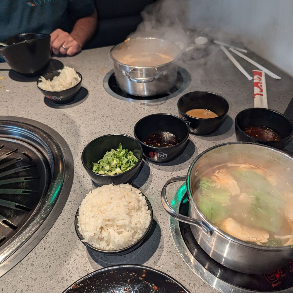 Top: Szechuan Spicy Hot Pot; Front: Thai Tom Yum hot pot Top: Szechuan Spicy Hot Pot; Front: Thai Tom Yum hot pot