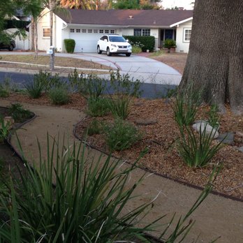 Go Green Gardeners - a car parked in front of a house - Landscaping Near Me - Los Angeles, California Go Green Gardeners - a car parked in front of a house - Landscaping Near Me - Los Angeles, California