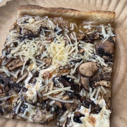 a slice of pizza on a paper plate a slice of pizza on a paper plate