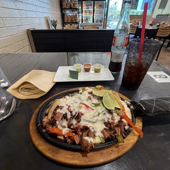Olivo’s Cafe Tortilla Factory - ALAMBRES Steak fajita with chorizo served on an onion bed with roasted poblano peppers and topped with mozzarella cheese. - Mexican Near Me - Hurst, Texas Olivo’s Cafe Tortilla Factory - ALAMBRES Steak fajita with chorizo served on an onion bed with roasted poblano peppers and topped with mozzarella cheese. - Mexican Near Me - Hurst, Texas