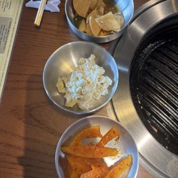 Banchan. Top to bottom. Pickled radish, Mac, and kimchi Banchan. Top to bottom. Pickled radish, Mac, and kimchi