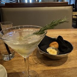 Tito's, jalapeño stuffed with cheese and rosemary martini--absolutely delicious. The warm bread is great and comes with honey butter. Tito's, jalapeño stuffed with cheese and rosemary martini--absolutely delicious. The warm bread is great and comes with honey butter.