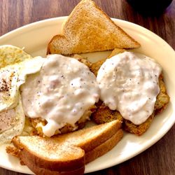 New Boston Tavern - 2 eggs over easy, fried potatoes with gravy, country fried steak with gravy and toast $8 !