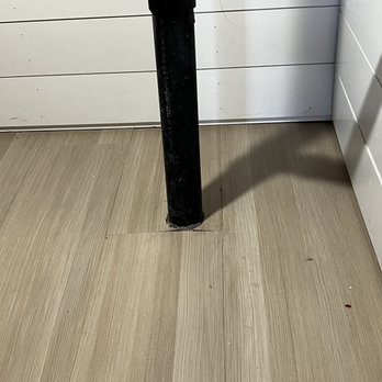 Toro Flooring - Here is a storage area that the did not make the cement flush prior to laying the floor around the pipe - Flooring Near Me Toro Flooring - Here is a storage area that the did not make the cement flush prior to laying the floor around the pipe - Flooring Near Me