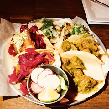 Clavel - Counterclockwise from the radish: two beef tongue tacos, carne de res (beef), lamb taco, fish taco, cochinita pibil (pork) taco. - Bars Near Me - Baltimore, Maryland