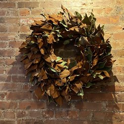 Wreath adorning brick wall