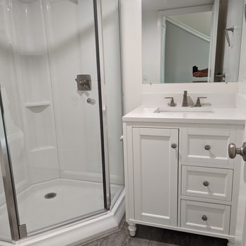 Gannage Design and Construction - a bathroom with a walk in shower - General Contractors Near Me - Templeton, California