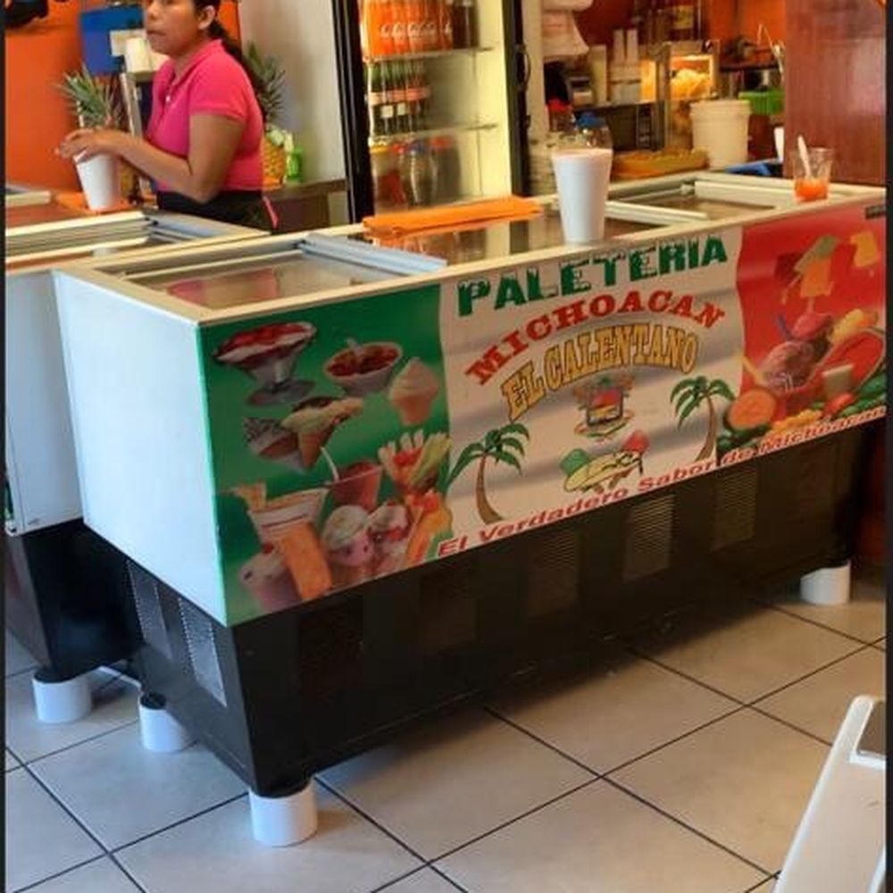 a woman standing at the counter a woman standing at the counter