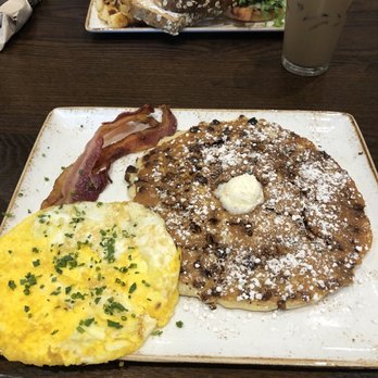 First Watch - Cinnamon & choc. Chip pancakes with a side of eggs and bacon all for under $10! - Breakfast & Brunch Near Me - Orlando, Florida