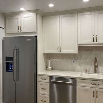 Capital Cabinets & Floors - a kitchen with stainless steel appliances - Flooring Near Me - North Highlands, California Capital Cabinets & Floors - a kitchen with stainless steel appliances - Flooring Near Me - North Highlands, California