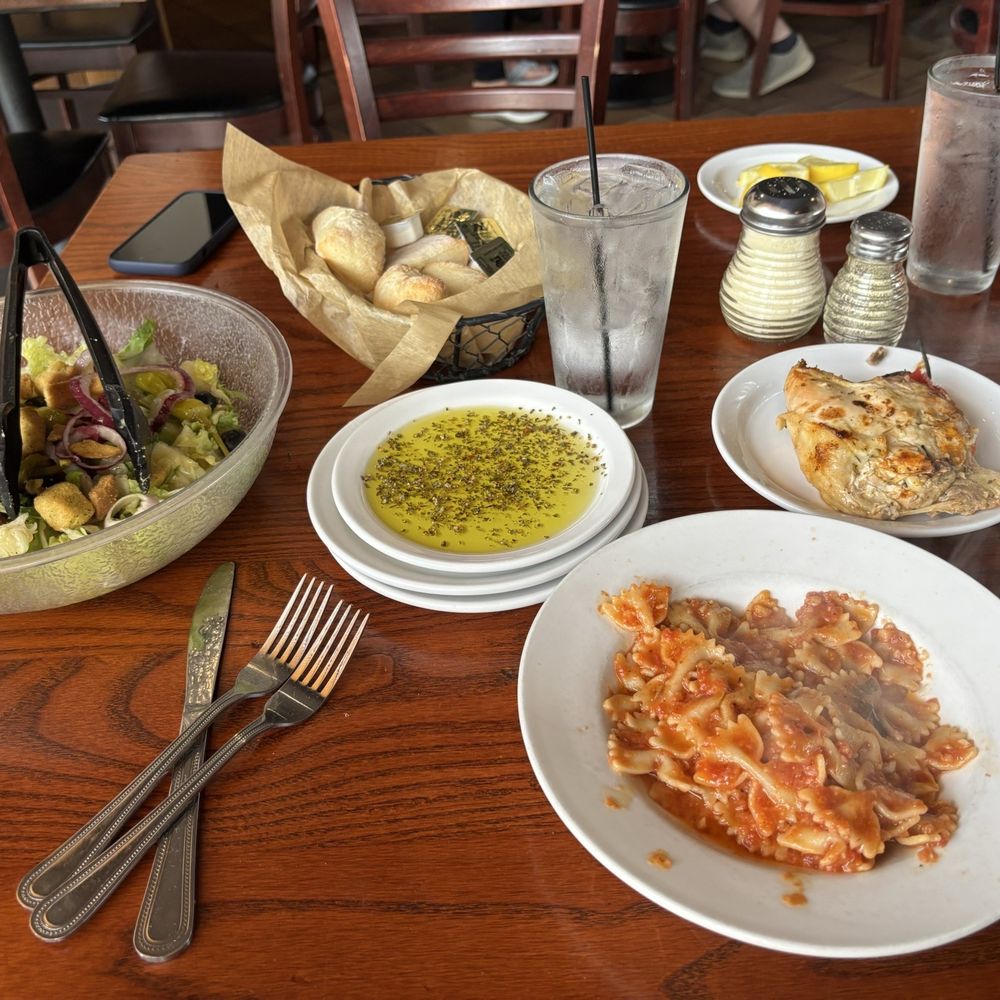 Tucci's - Garden salad, bowtie, pasta, with mariner, chicken Vesuvia - Italian Near Me - Bourbonnais, Illinois Tucci's - Garden salad, bowtie, pasta, with mariner, chicken Vesuvia - Italian Near Me - Bourbonnais, Illinois