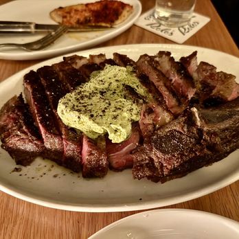 Rolo's - Wood Fire House Dry Aged Prime Ribeye with a Green Garlic Butter - Sandwiches Near Me - Ridgewood, New York Rolo's - Wood Fire House Dry Aged Prime Ribeye with a Green Garlic Butter - Sandwiches Near Me - Ridgewood, New York