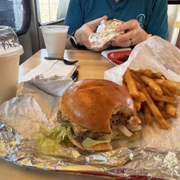 Lucky burger, Fries, and a pineapple shake.