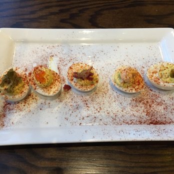 The Row - Deviled eyes with salmon, pinto cheese, bacon, sweet and dill pickle on top. - Southern Near Me - Nashville, Tennessee The Row - Deviled eyes with salmon, pinto cheese, bacon, sweet and dill pickle on top. - Southern Near Me - Nashville, Tennessee
