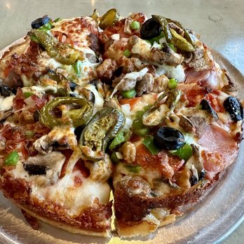 Lost Pizza Co. - Kujo Bacon, hickory ham, pepperoni, Italian sausage, ground beef, onions, green peppers, black olives & mushrooms - Salad Near Me - Miramar Beach, Florida