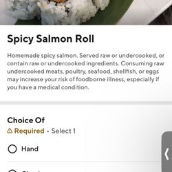 Yoshi Sushi - Screenshot of the description on DoorDash. No mention of found tempura flakes or tobiko in the spicy salmon mixture.