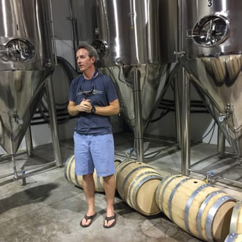 Waypoint Spirits - Doug, one of the owners, in front of 1000 gallon fermentation tanks - Beer, Wine & Spirits Near Me - Bloomfield, Connecticut