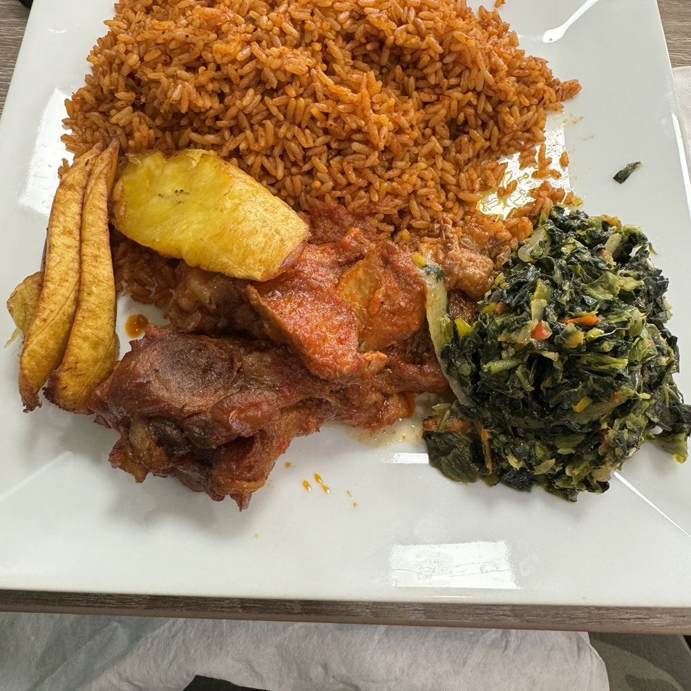 Chicken, Jollof Rice, Spinach, and Plantain. Chicken, Jollof Rice, Spinach, and Plantain.