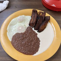 Santa Rosa Restaurant - Friend plantains, beans, crema, juevos with tortillas.